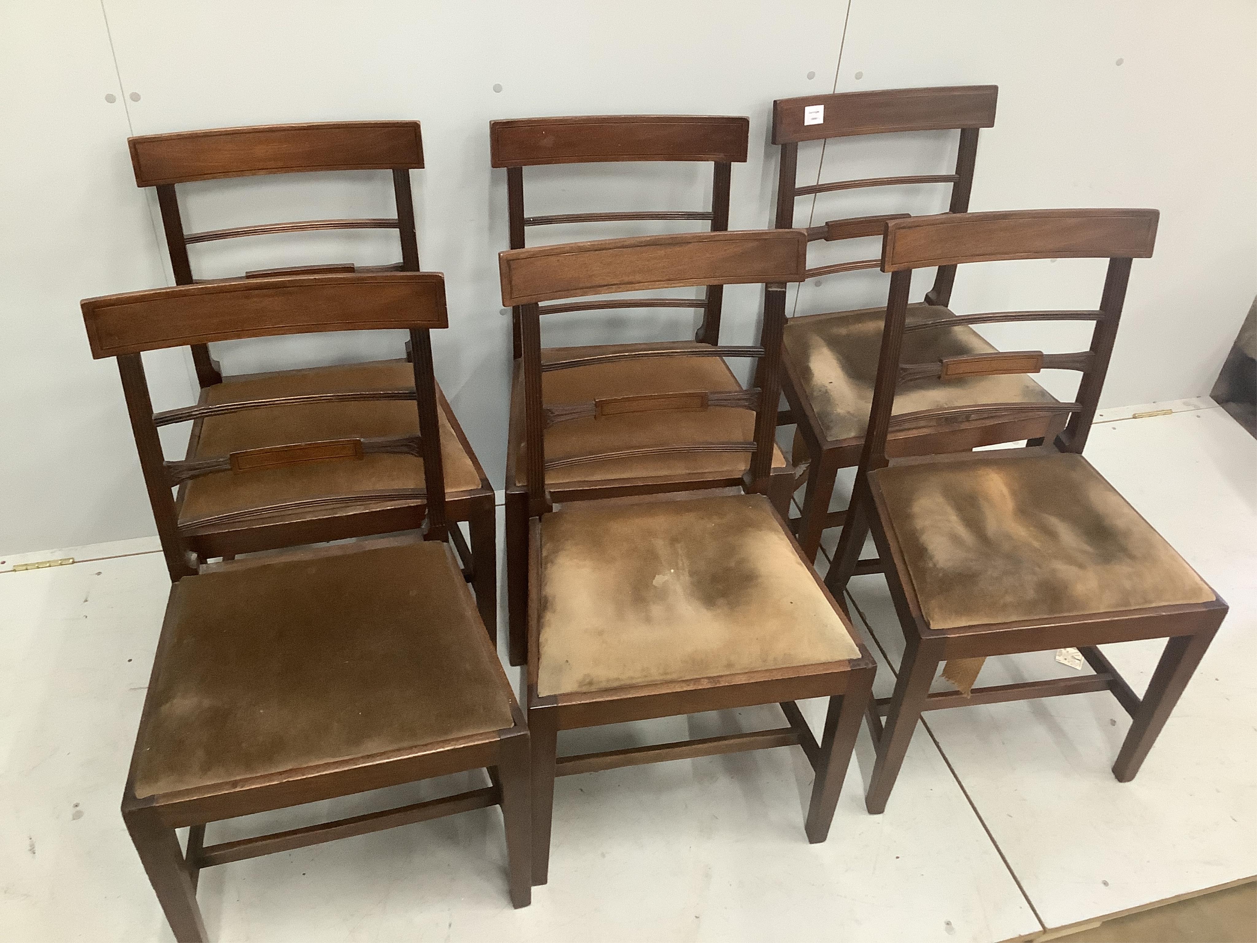 A set of six George III inlaid mahogany dining chairs. Condition - fair, drop in seats poor